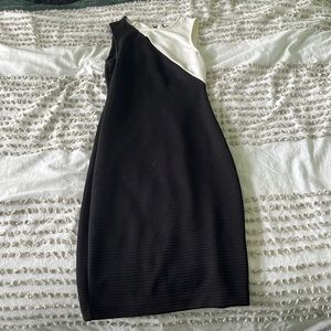 Black and white jennifer lopez dress, Tight with a slit near the chest